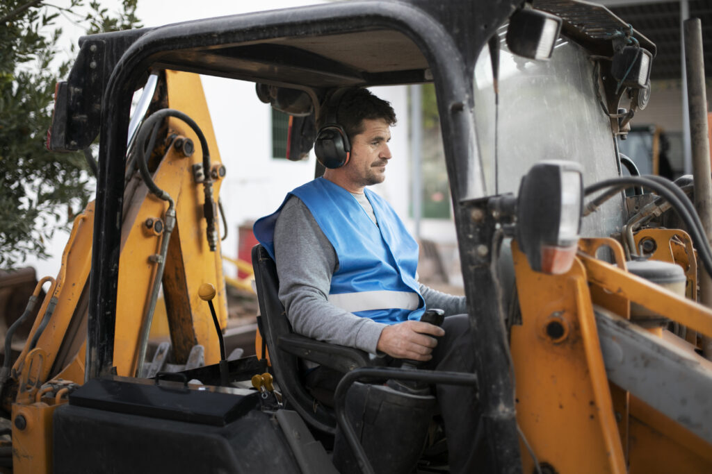 man using an excavator-digging in daylight